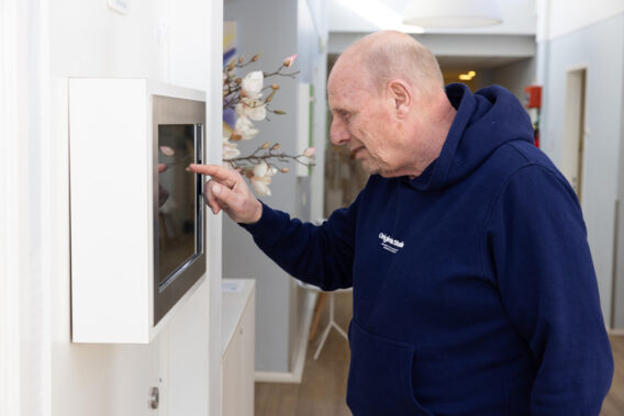 Photo of a patient registering at the registration kiosk at Dental Clinics
