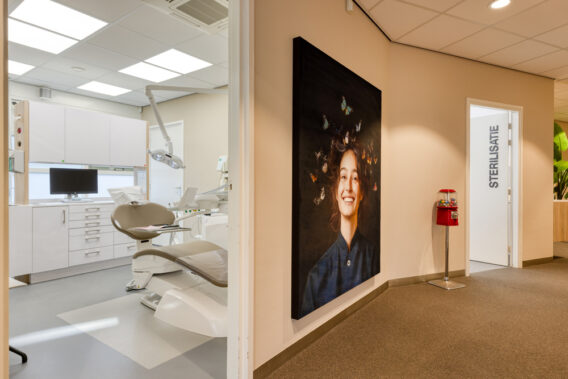 On the left, a glimpse into the treatment room, and on the right, a picture in the waiting room at Dental Clinics